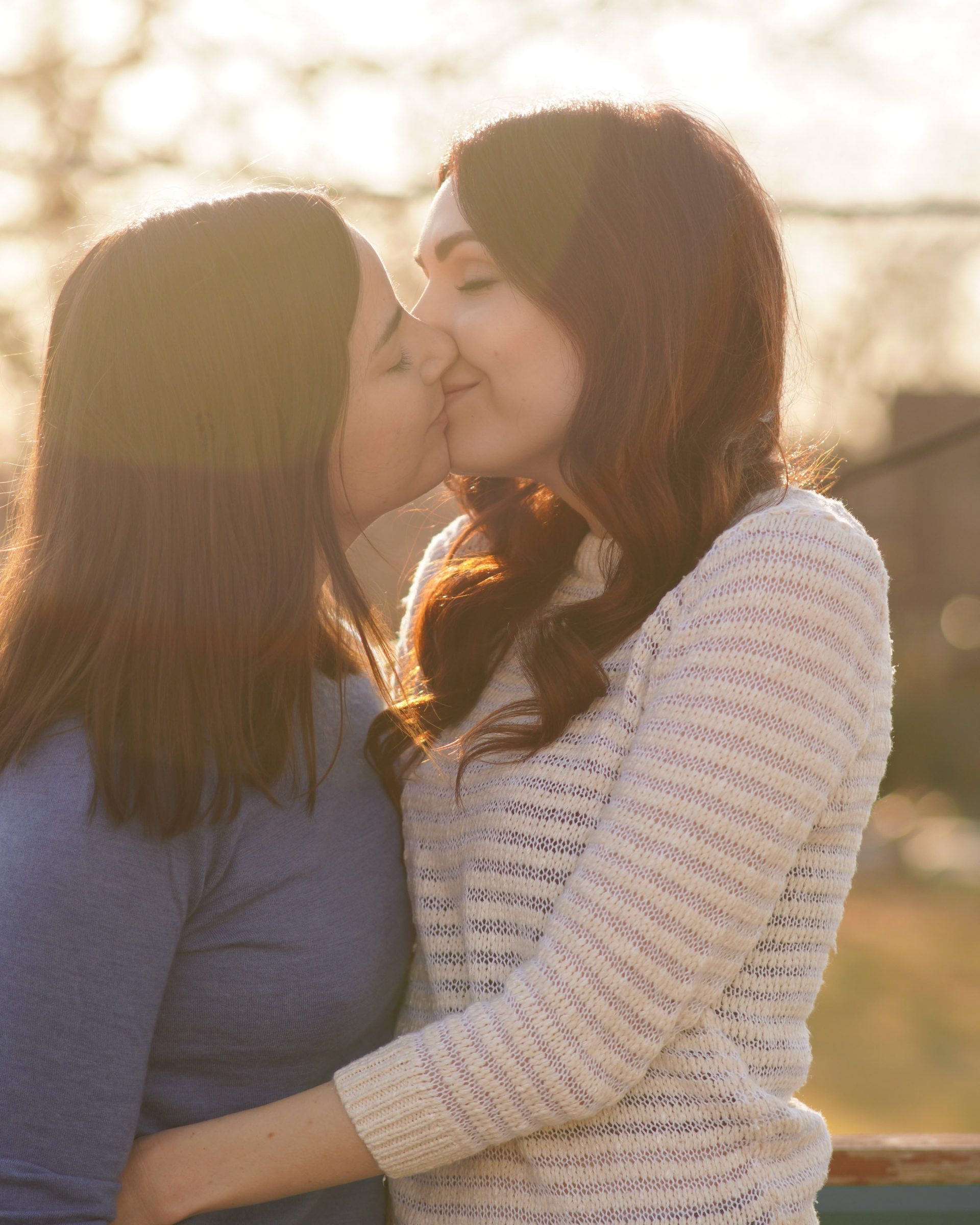 Lesbian Couple Kiss Balcony Sunset