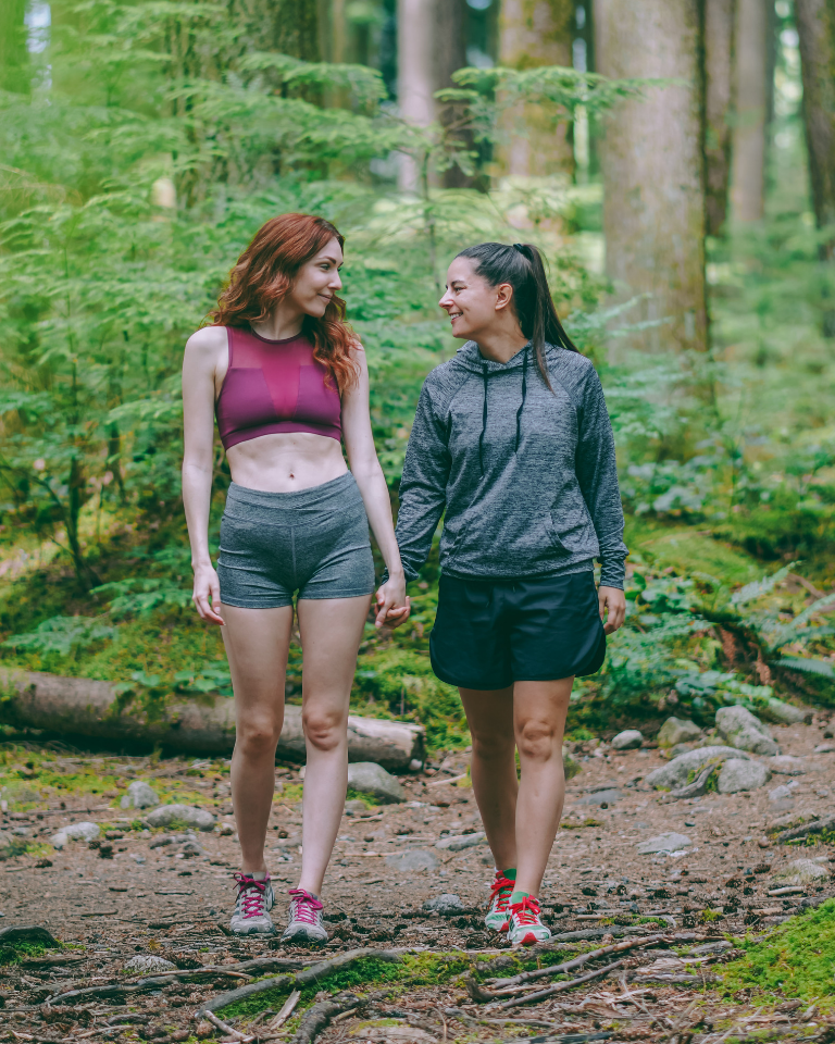 Lesbian Couple Walking through Forest