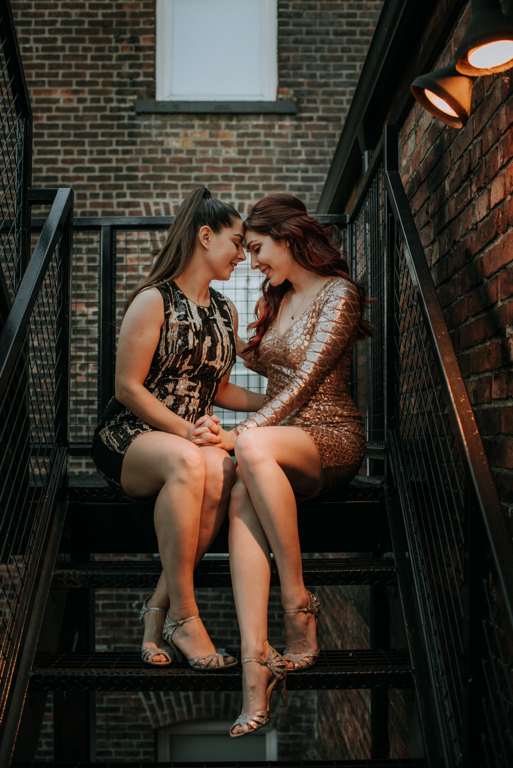 Lesbian Couple City Fire Escape Sunset