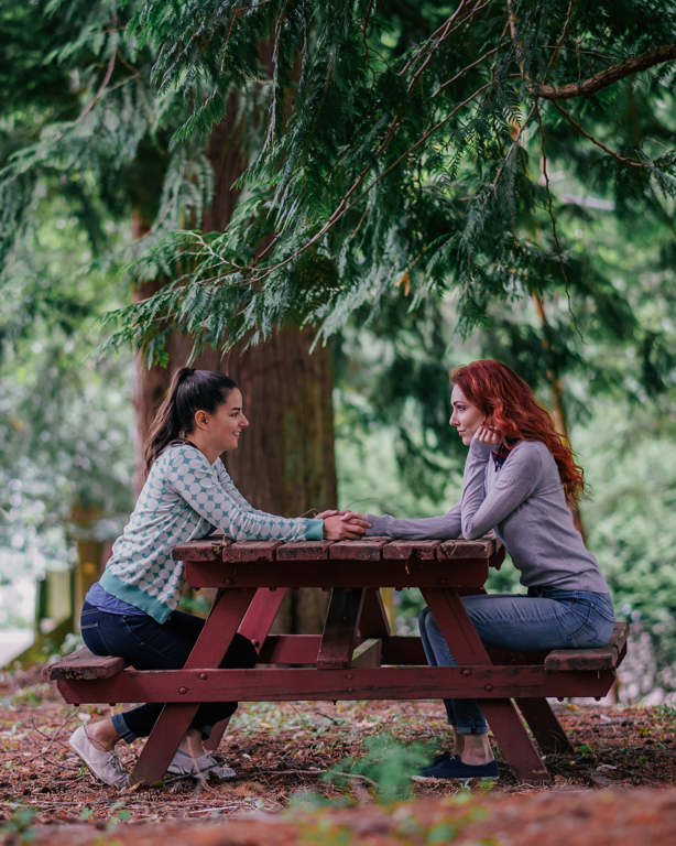Lesbian Couple Picnic Table Woods